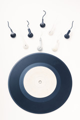 fertilization or hit the target concept, made of gramophone record and earphones