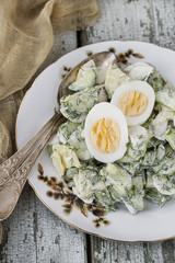 potato salad with egg, radishes and cucumbers