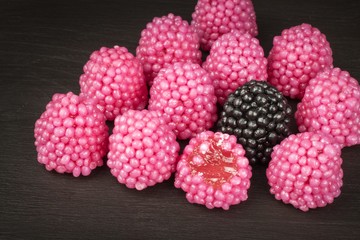 Jelly candies on a background. Pile of multiple different candies. Risk of obesity and tooth decay.