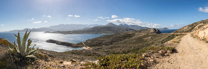Panoramic of west coast and mountains from Revellata in Corsica