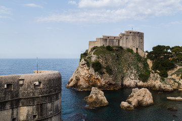 Fototapeta na wymiar Corner of Dubrovnik's city walls seen by Fort Lovrijenac