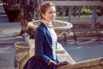 Romantic young beautiful lady outdoors. Victorian style