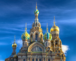 Fototapeta na wymiar The Church of the Savior on Spilled Blood is one of the main sights of St. Petersburg, Russia, also known as the Cathedral of the Resurrection of Christ. Blue sky. Spring sunny view.