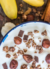 Serving of White Yogurt with  Muesli, Banana and Nuts