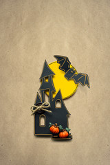 Happy halloween / Creative halloween concept photo of a castle made of paper on brown background.

