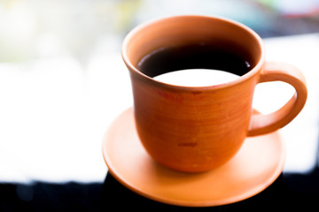 Black coffee in cray cup close up.