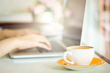 Cup of coffee and smart devices on the table close up.