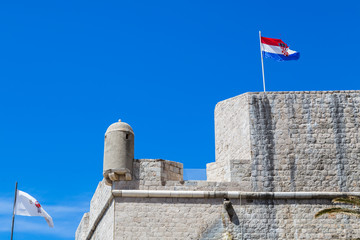 Looking up at a corner of the Dubrovnik city walls