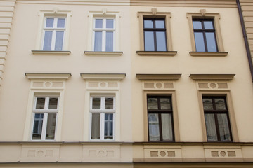 The facades of two houses standing side by side.