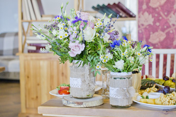 Wedding festive interior, table decorations, flowers, table setting, wine glass, pastel summer tones