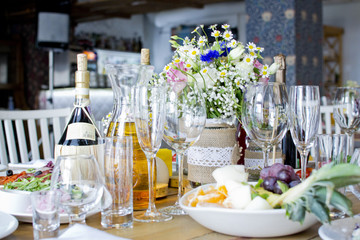 Wedding festive interior, table decorations, flowers, table setting, wine glass, pastel summer tones