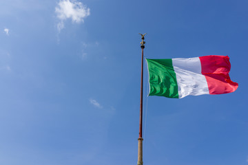 Fototapeta na wymiar Windy waving Italy flag with blue sky