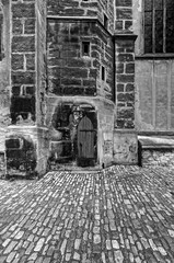Small wooden door in the stone wall