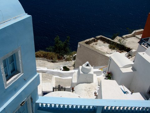 Roofs of the island of Santorini/View of the roofs and walls of buildings in Santorini, Greece, Cyclades. Typical white and blue architecture. From travels in the Mediterranean