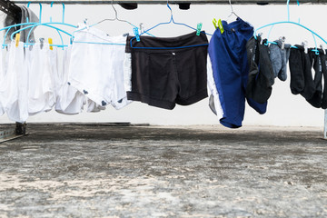 Dry cloths T-Shirt and jean hang on the clothesline