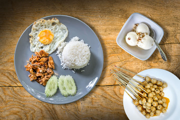 rice with fried pork with garlic, fried egg and pork balls and ice cream