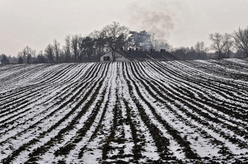 Farm land near the house in winter season