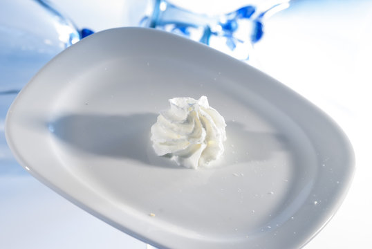 whipping cream on white plate 