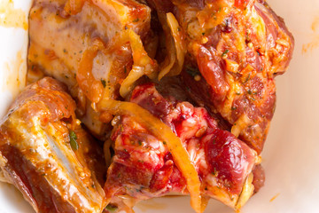 Raw pork ribs in marinade. The concept of cooking.
