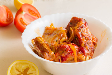 Raw pork ribs in marinade and ingredients. The concept of cooking.