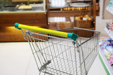 Kaluga, Russia - April, 21, 2017: Interior of a supermarket in Kaluga, Russia with shop trolley on a frontground