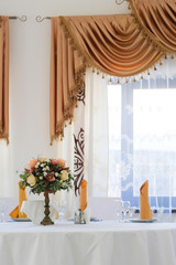 Interior of a cafe with the serviced tables