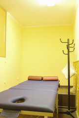 Massage table in an empty room