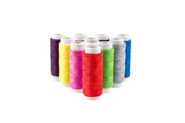 Colorful sewing threads isolated on white background.