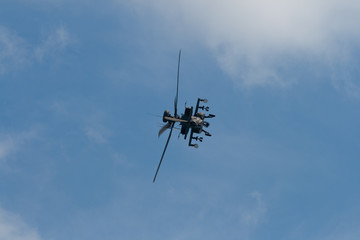 Military helicopter aerobatic demonstration team performing at Singapore Air Show 2010