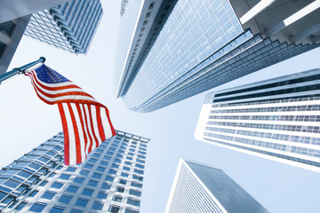 View of American flag on blue building background