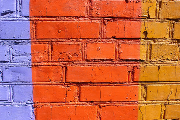 Colored old brick wall in different colors