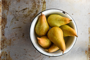Top view of pears in bowl. Rustic vintage style