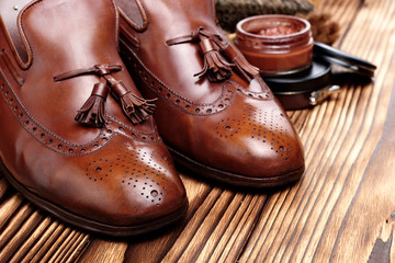leather shoes brogues loafers with shoe maintenance set.Shoes care.copy space.closeup