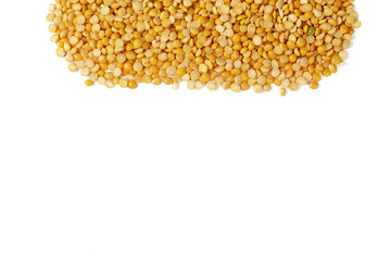 Dry yellow split peas isolated on white.