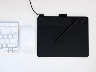 Essential gadgets (computer keybord, mouth, and pen&touch tablet ) for work on  every day.