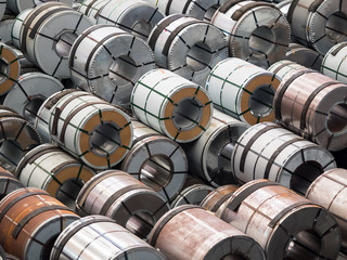 Fototapeta premium Steel coils at storage area in steel industry warehouse