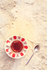 Hot turkish tea outdoors near water. Turkish tea and traditional turkish culture concept
