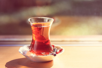 Hot turkish tea outdoors near glass wall. Turkish tea and traditional turkish culture concept