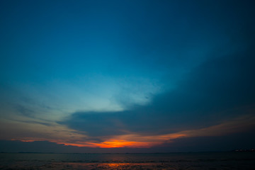 Naklejka na ściany i meble Sunset on the beach with beautiful sky