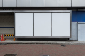 Large blank billboard on a street wall, banners with room to add your own text