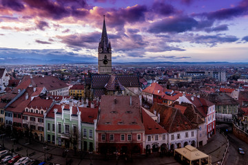 Fototapeta premium The Evangelical Church on Huet Square at sunset in Sibiu, Romania, November 2015