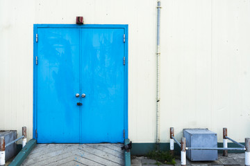 Blue door with warehouse closeup