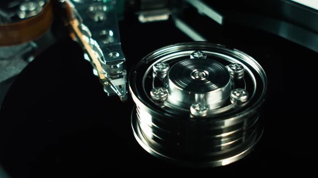 Computer hard disk, hdd. Head and hard drive spindle close-up. Technology of information storage. Arrays of data, servers. innovative technologies. Storage and transmission of information