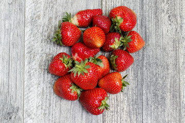 Red strawberryies on wooden table