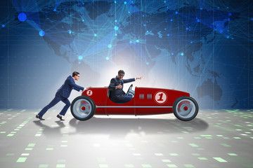 Businessman car pushing in teamwork concept