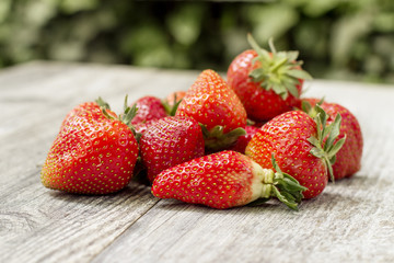 Red strawberryies on wooden table