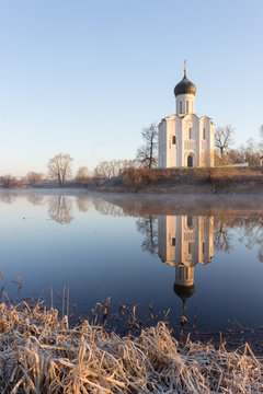 View to the Church of the Intercession of the Holy Virgin on the Nerl River in sunlight.