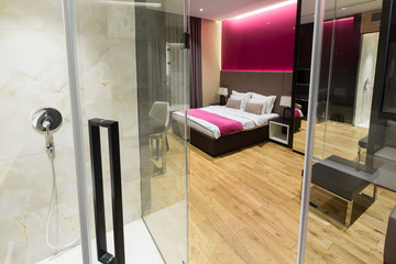 Interior of a hotel bedroom with bathroom