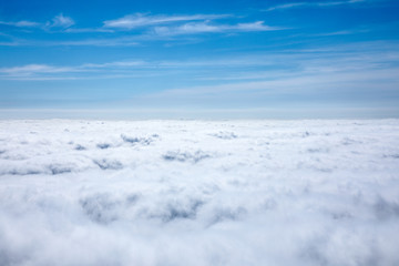 Fototapeta na wymiar Clouds and blue sky seen from plane