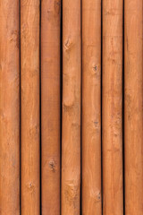 closeup, wooden fence with round columns, wood grain